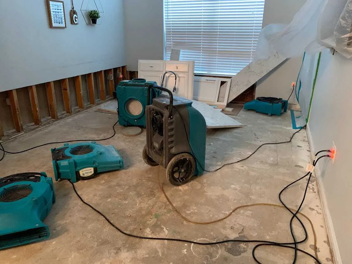 Dehumidifier in flood-cut room for Water Damage Restoration in Polson